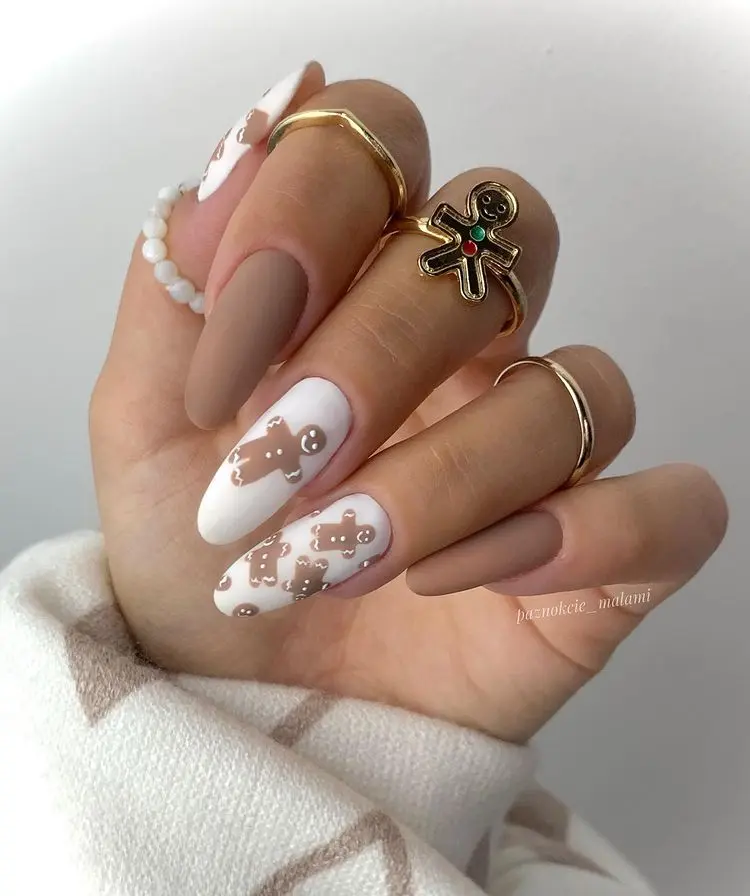 matte nude and white nail polish gingerbread man december nails design 2022 current trends