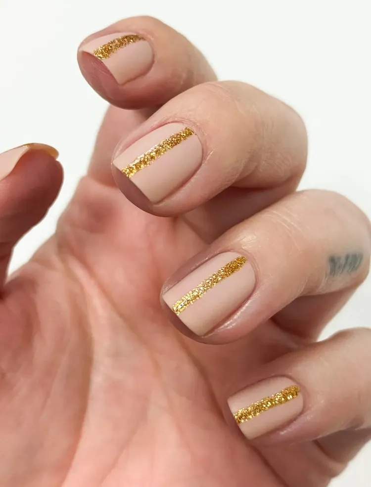 nail art trend 2022 nude manicure with golden accents