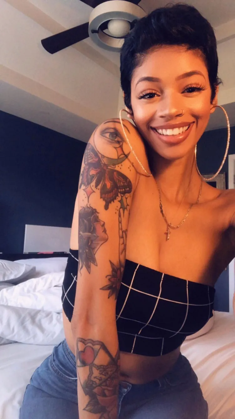 red tattoo idea on black skin woman arm