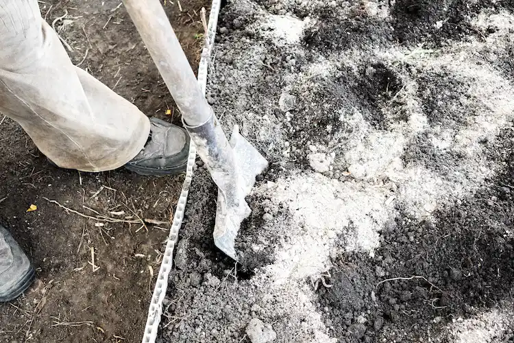reuse wood ash as a calcium rich fertilizer in the garden soil