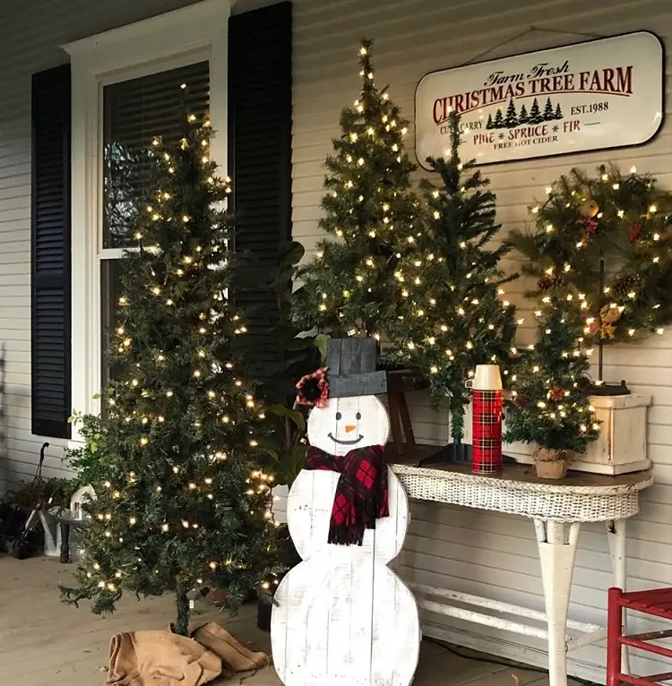 snowman decorations for veranda and front porch on christmas minimalistic natural tree