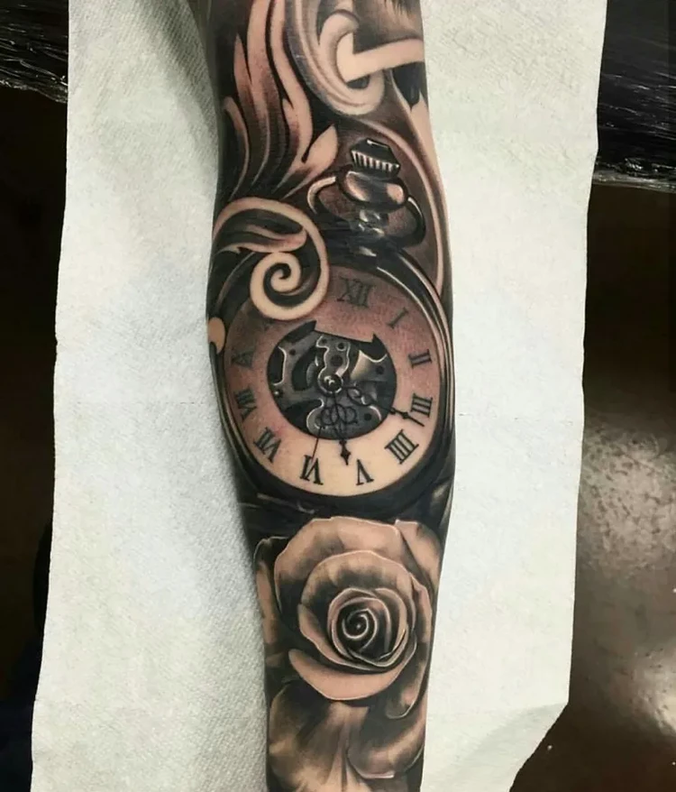 tattoo forearm man clock