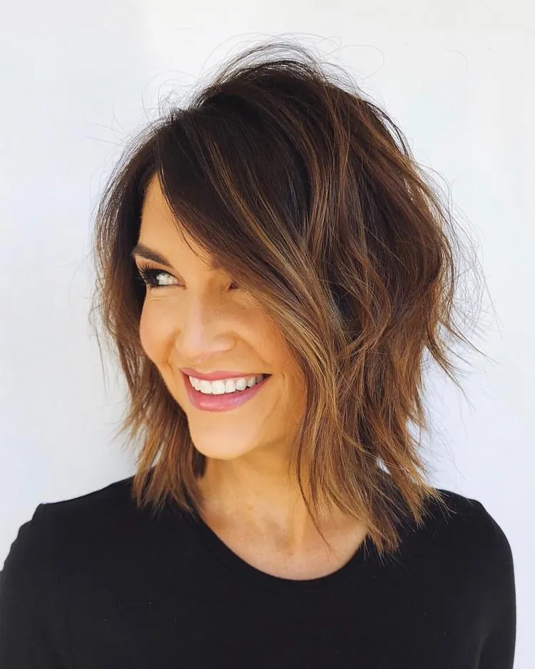 wavy bob rejuvenating cut woman 50 year old honey balayage dark chestnut brown hair