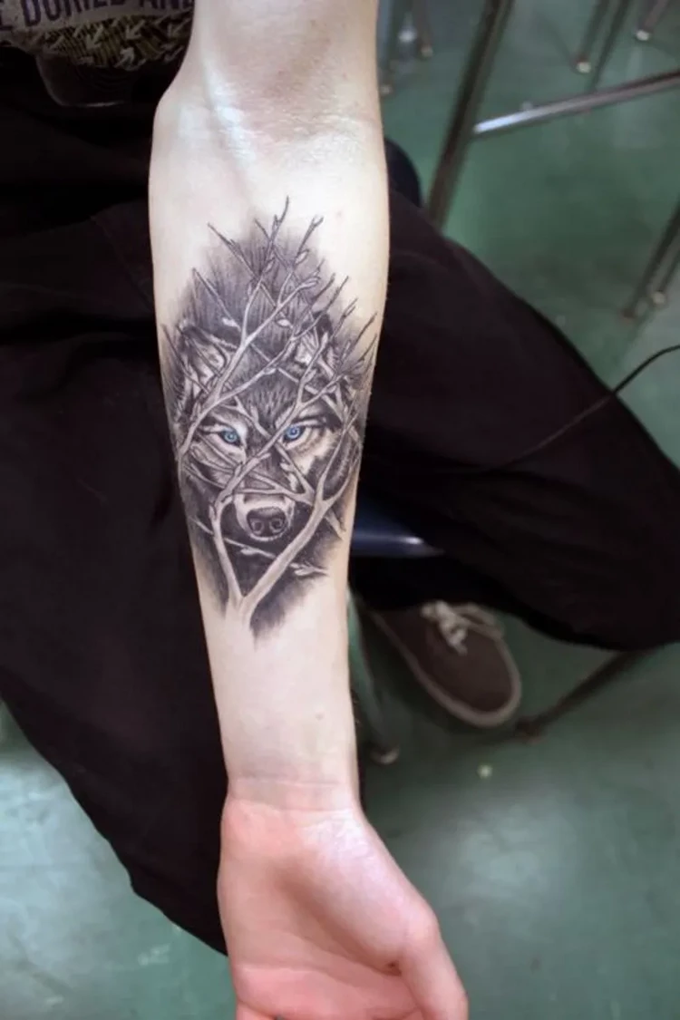 wolf head graphic tattoo forearm