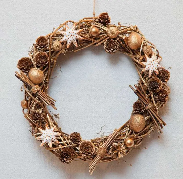 wreath from natural materials pine cones tree trimmings golden nut