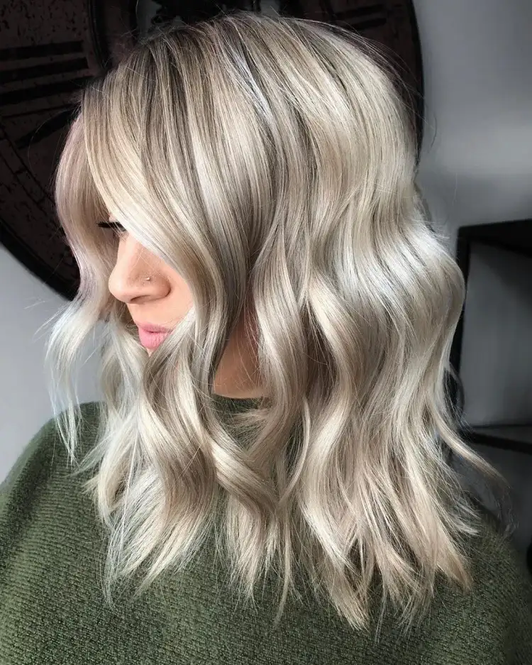 Ash Blonde hair color trends 2023 medium length curled hair