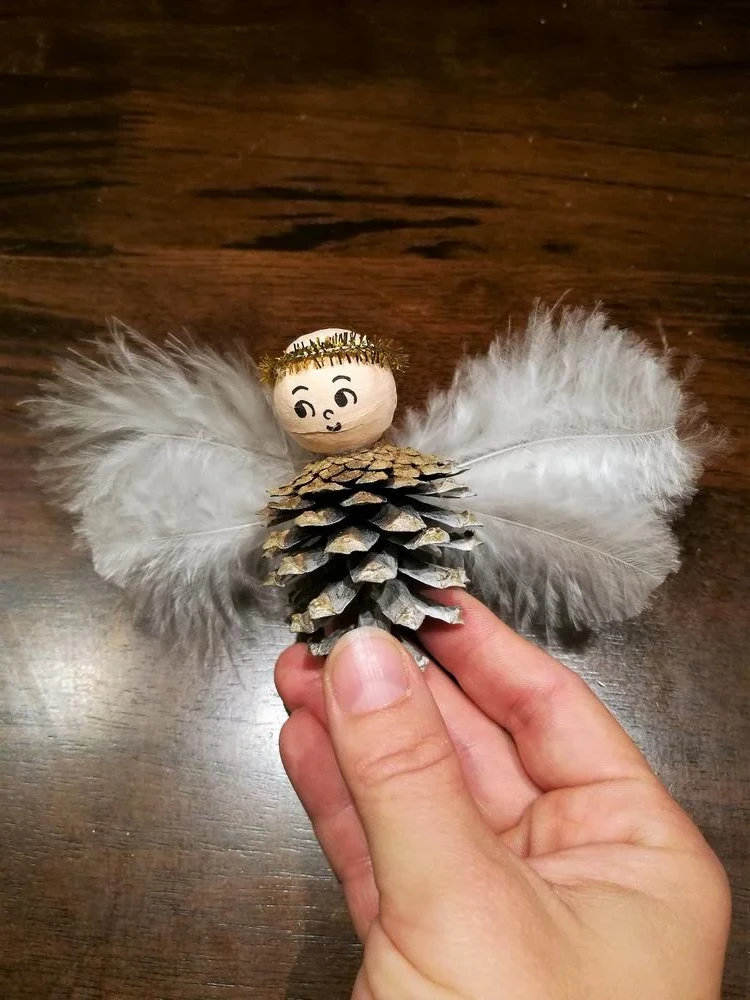 Cone Christmas angel with wooden bead for head and feather as wings