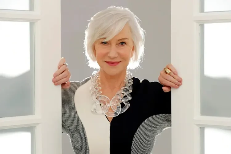 Helen Mirren in a neutral color combination and a big statement necklace
