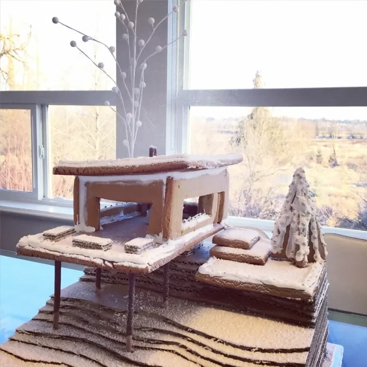 House on a hillside made of gingerbread dusted with icing sugar