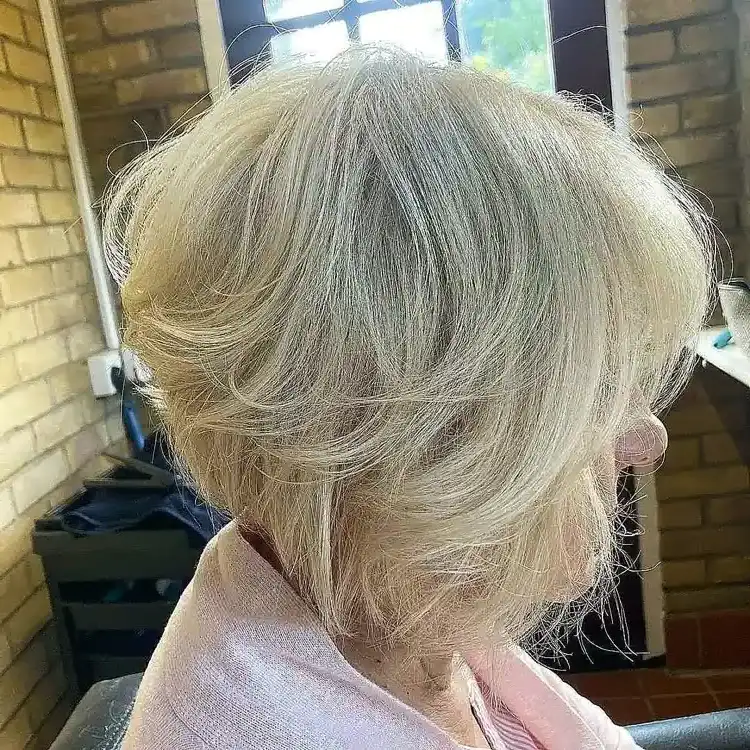 Layered bob hairstyle for women over 60 with thin hair