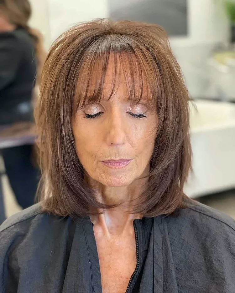 Long layered bob for women over 60 with thin bangs