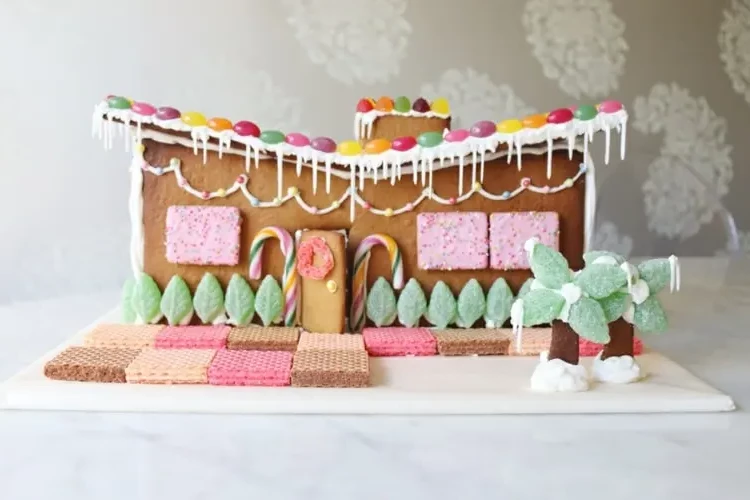 Modern gingerbread house decorated with gummy and icing