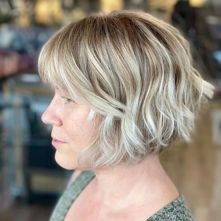 Shaggy bob with bangs for older ladies with oval face