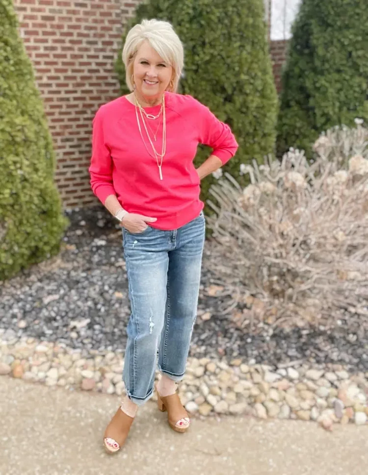 What colors to avoid after 60 combine the right jeans with a pink sweater