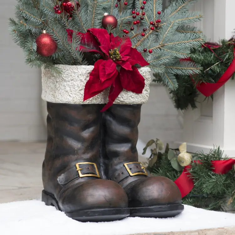 cement christmas santa claus boots dark brown fluffy white top conifer branches artificial flower