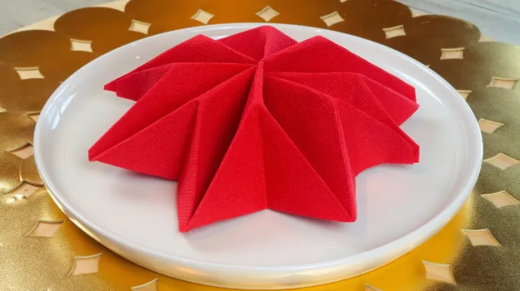 christmas red star napkin fold poisenttia symbol of christmas approaching surprise your loved ones at the table
