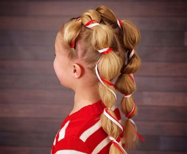 creative christmas hairstyle for children ponytails with white and red ribbon