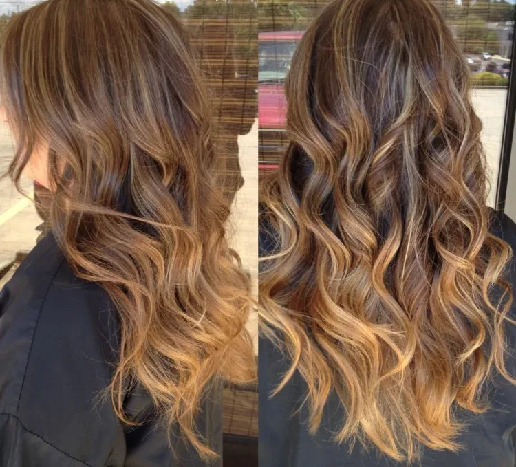 curly long dark brown hair with highlights at the bottom trendy look 2023