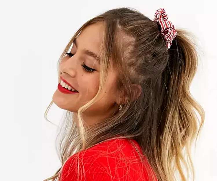 cute hairstyle with a scrunchie half up half down christmas hairstyle for her