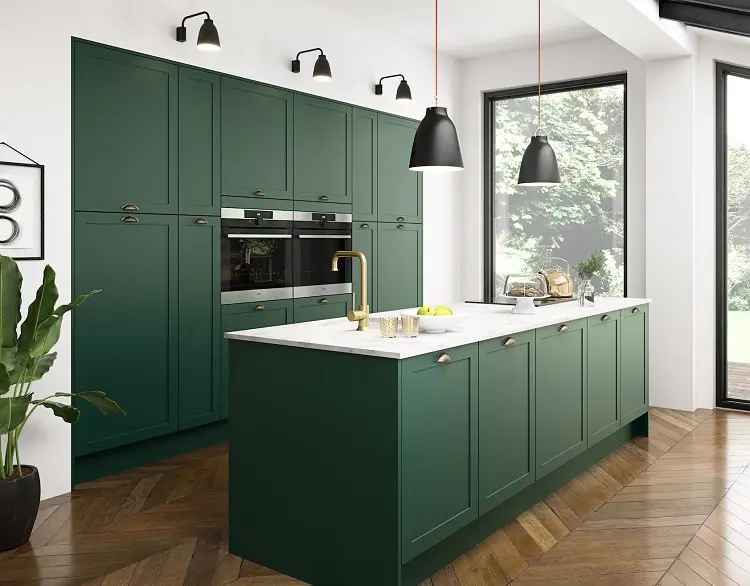 dark green kitchen cabinets with golden handles white countertop modern interior design trends 2023