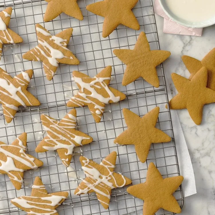 decorate baked christmas cookies with royal icing