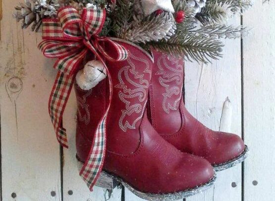 diy christmas boots decoration ideas old red boots full of greenery hung on door