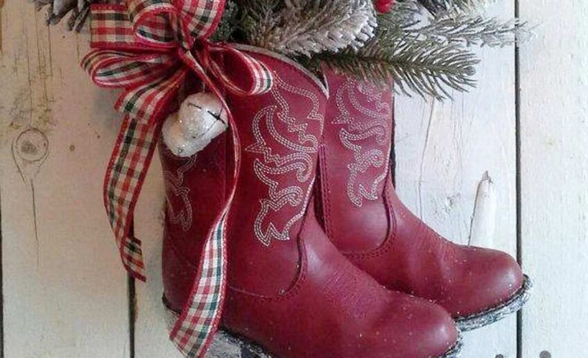 diy christmas boots decoration ideas old red boots full of greenery hung on door