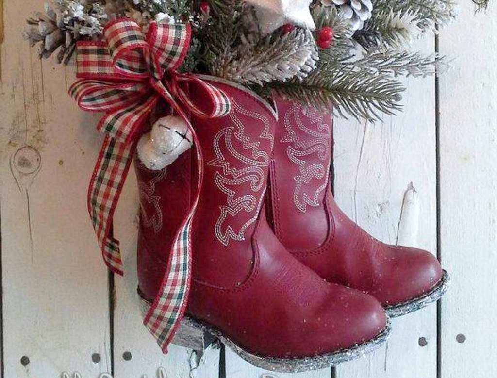 https://deavita.net/wp-content/uploads/2022/12/diy-christmas-boots-decoration-ideas-old-red-boots-full-of-greenery-hung-on-door.jpg