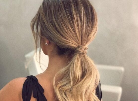 elegant low ponytail blonde long wavy hair modern look hairstyles 2023