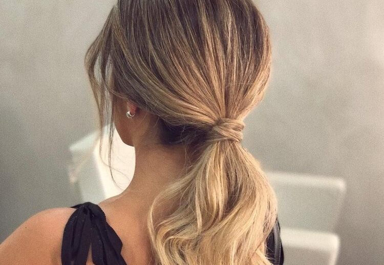 elegant low ponytail blonde long wavy hair modern look hairstyles 2023