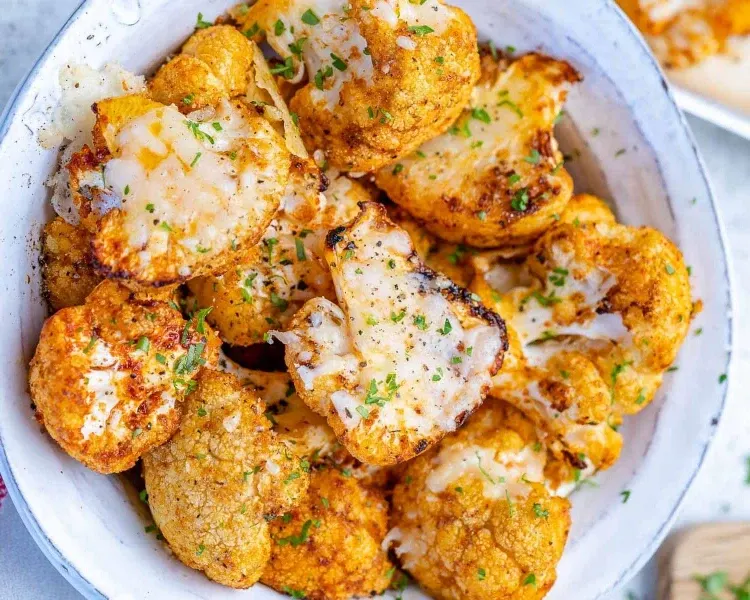 garlic parmesan roasted cauliflower with herbs and spices