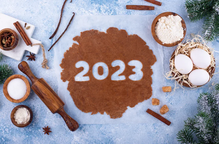 gingerbread dough for christmas cookies molded with new year 2023