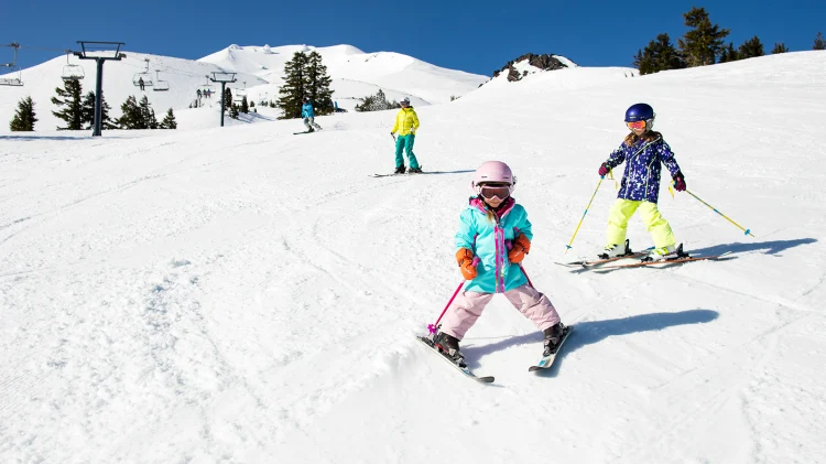 winter activities for kids go skiing in the mountains children having fun during winter break