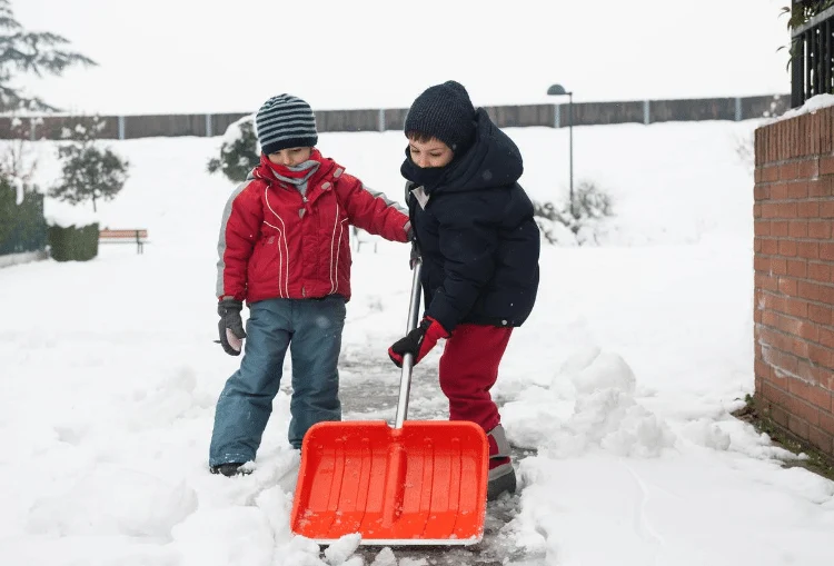 help neighbors shovel snow around the house in winter
