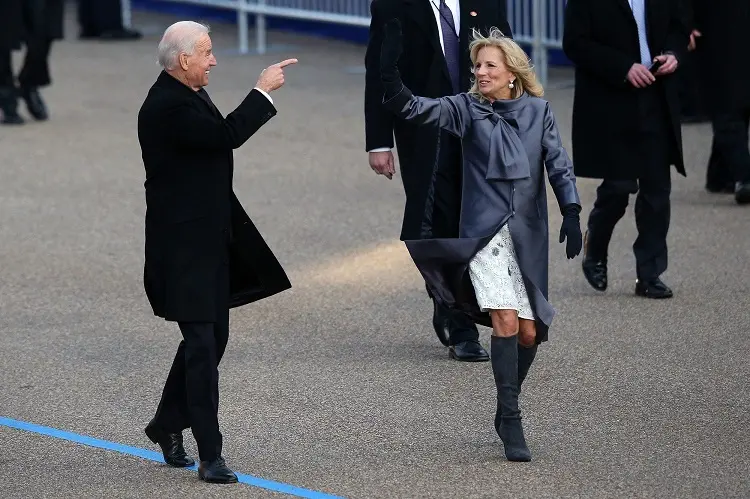 jill biden outfits satin gray coat and long boots fashion trends first lady of america how to dress for the holidays in 2022 for women over 60