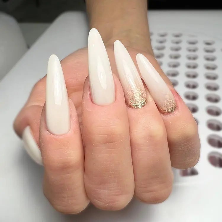 long nails gold sparkle eggshell white new years eve trendy party designs