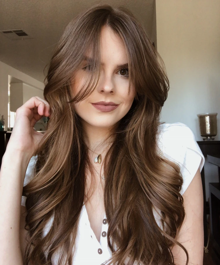 long wavy hair with a fringe chestnut hair color