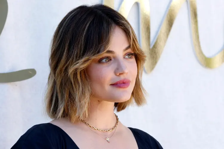 medium length haircut with fringe ombre technique slightly curled hair