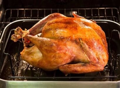 roasted turkey stuffed with rice and bacon traditional christmas dinner