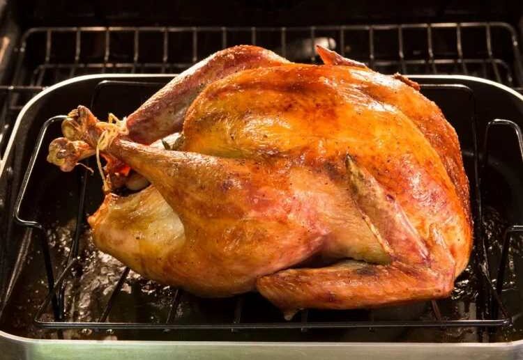 roasted turkey stuffed with rice and bacon traditional christmas dinner