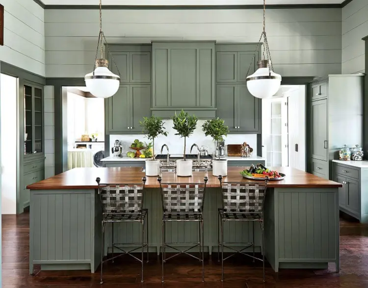 sage green kitchen interior design cabinets wood countertop iron chairs trendy in 2023