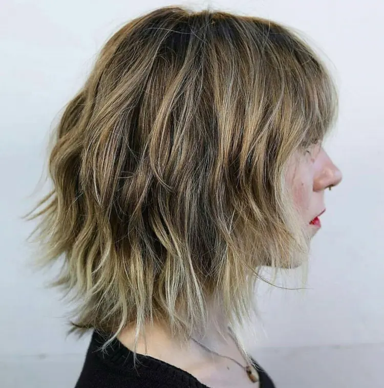 shaggy bob hairstyle on fair hair layered hairstyle with blond highlights