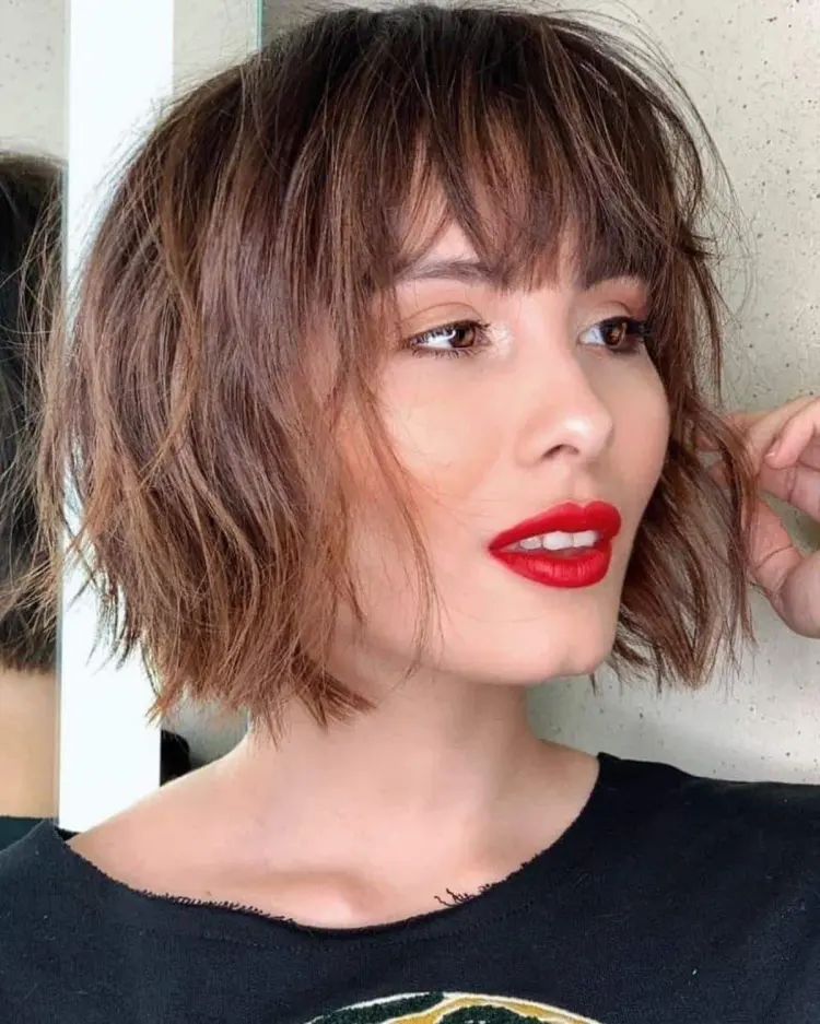 short messy bob with bangs slightly curled casual everyday look