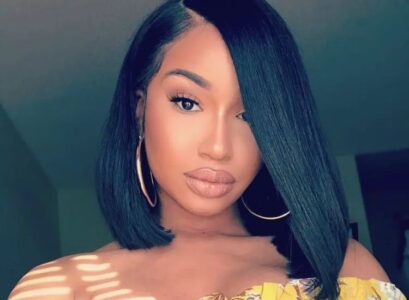 side part weave bob asymmetri cut black straight hair slightly curled at the ends towards the face