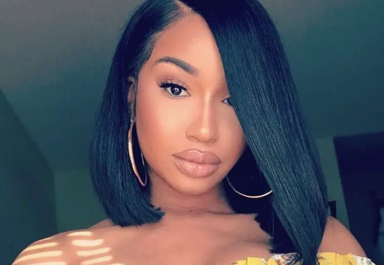 side part weave bob asymmetri cut black straight hair slightly curled at the ends towards the face