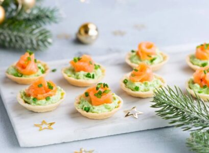 tartlets with avocado sauce with fresh dill lemon juice smoked sliced salmon puff pastry shells appetizers for New Year's party