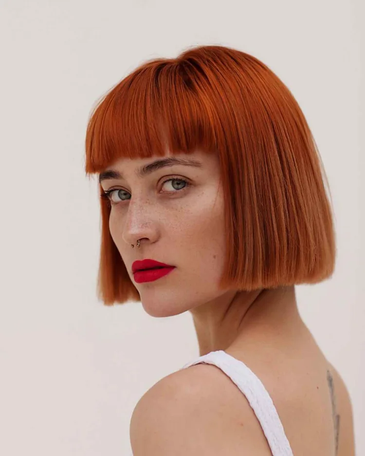 thick red hair blunt bob with blunt bangs