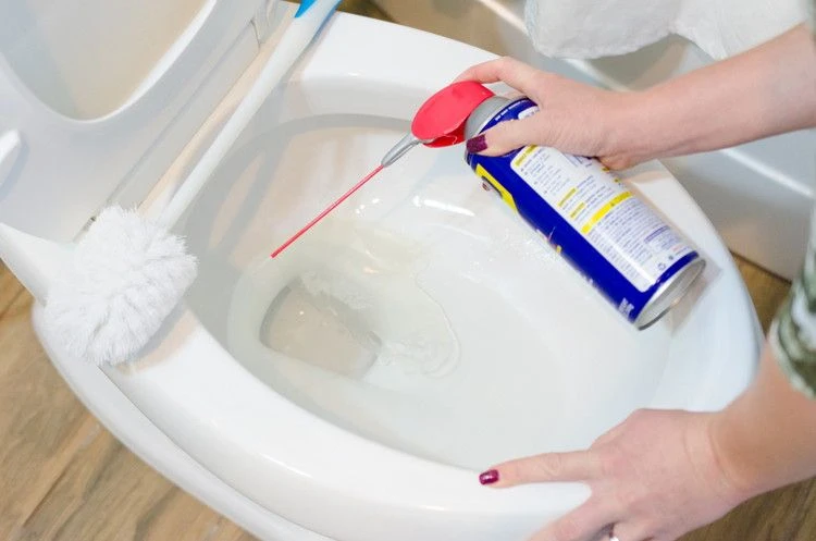 use WD40 to remove rust stains in toilets