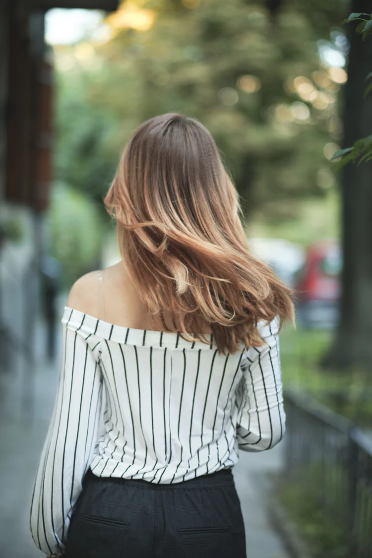 walking woman medium length hair moving as she is walking