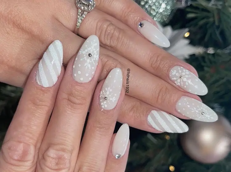 white candy cane nails decoration with snowflakes christmas nail art design